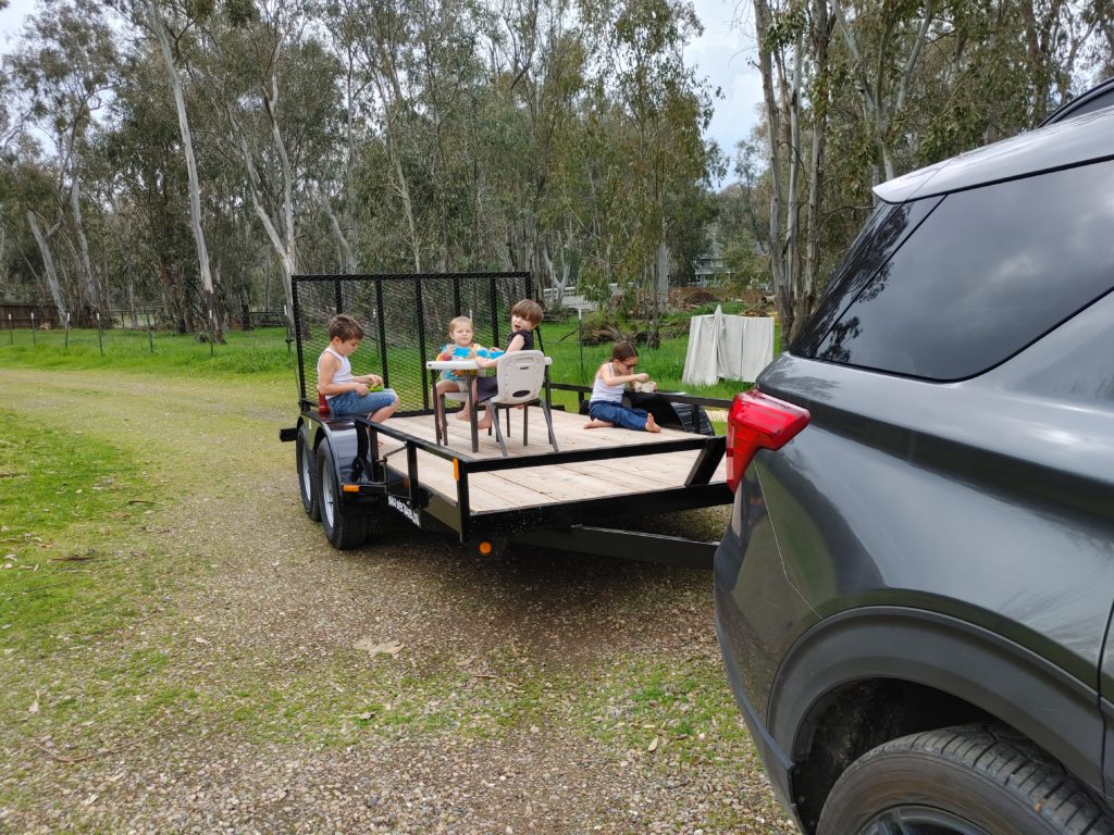 Kids having a tea party on a trailer